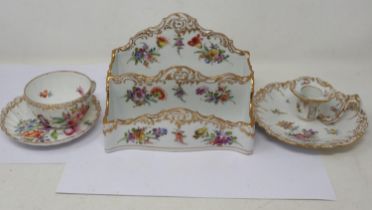 Dresden painted and gilt chamber stick with a letter rack and cup with saucer in the same design, no