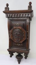 Carved oak wall stand with metal embellishments, H: 50 cm. UK P&P Group 3 (£30+VAT for the first lot