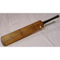 Cricket interest: a full-size bat, bearing signatures of the 1950 England and West Indies teams.