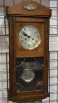 Mahogany cased wall clock with glass door, pendulum and key. Not available for in-house P&P