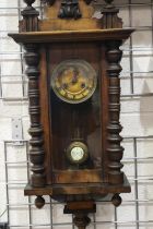 Mahogany cased wall clock with pendulum, requires attention. Not available for in-house P&P