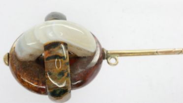 Scottish hardstone Edwardian hatpin on a yellow metal spine, L: 11 cm. UK P&P Group 0 (£6+VAT for