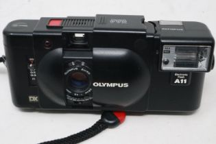 Olympus XA4 camera, shutter working. UK P&P Group 2 (£20+VAT for the first lot and £4+VAT for