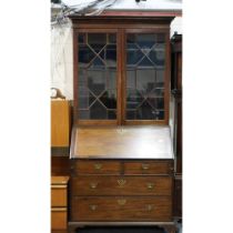 George III cross banded walnut bureau bookcase with twin astragal glazed doors, fitted interior