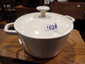 Le Creuset style cream enamelled casserole pot with a quantity of silicone cookware. Not available