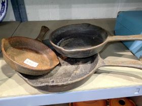 Three cast iron frying pans. Not available for in-house P&P