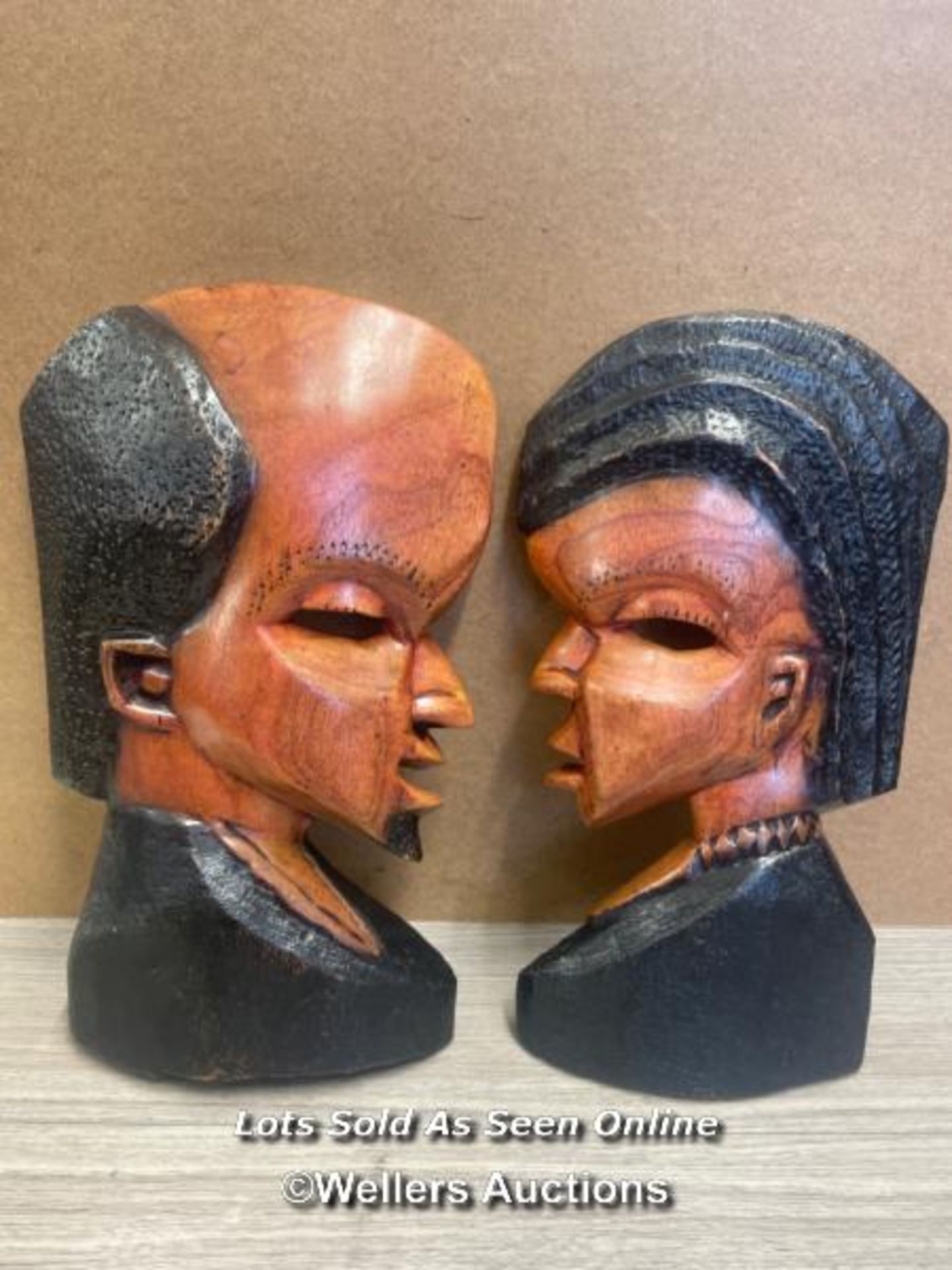 PAIR OF AFRICAN CARVED PROFILE'S OF A MAN AND WOMAN, TALLEST 46CM HIGH