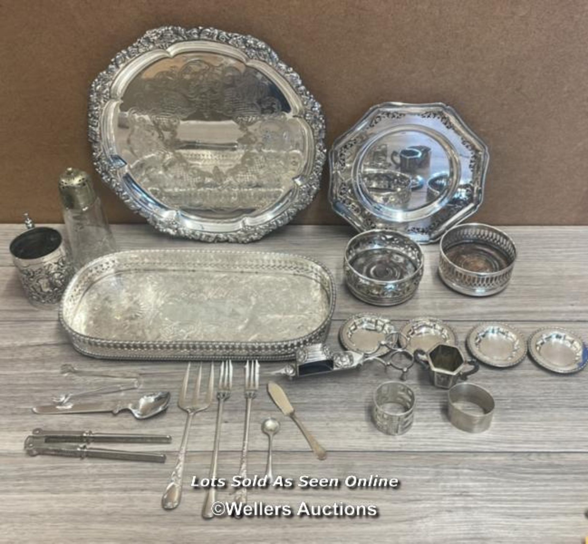 ASSORTED ANTIQUE METAL WARE INCLUDING TRAYS, PEPPER POT, ORNATE CUP , CUTLERY AND CANDLE SNUFFER (