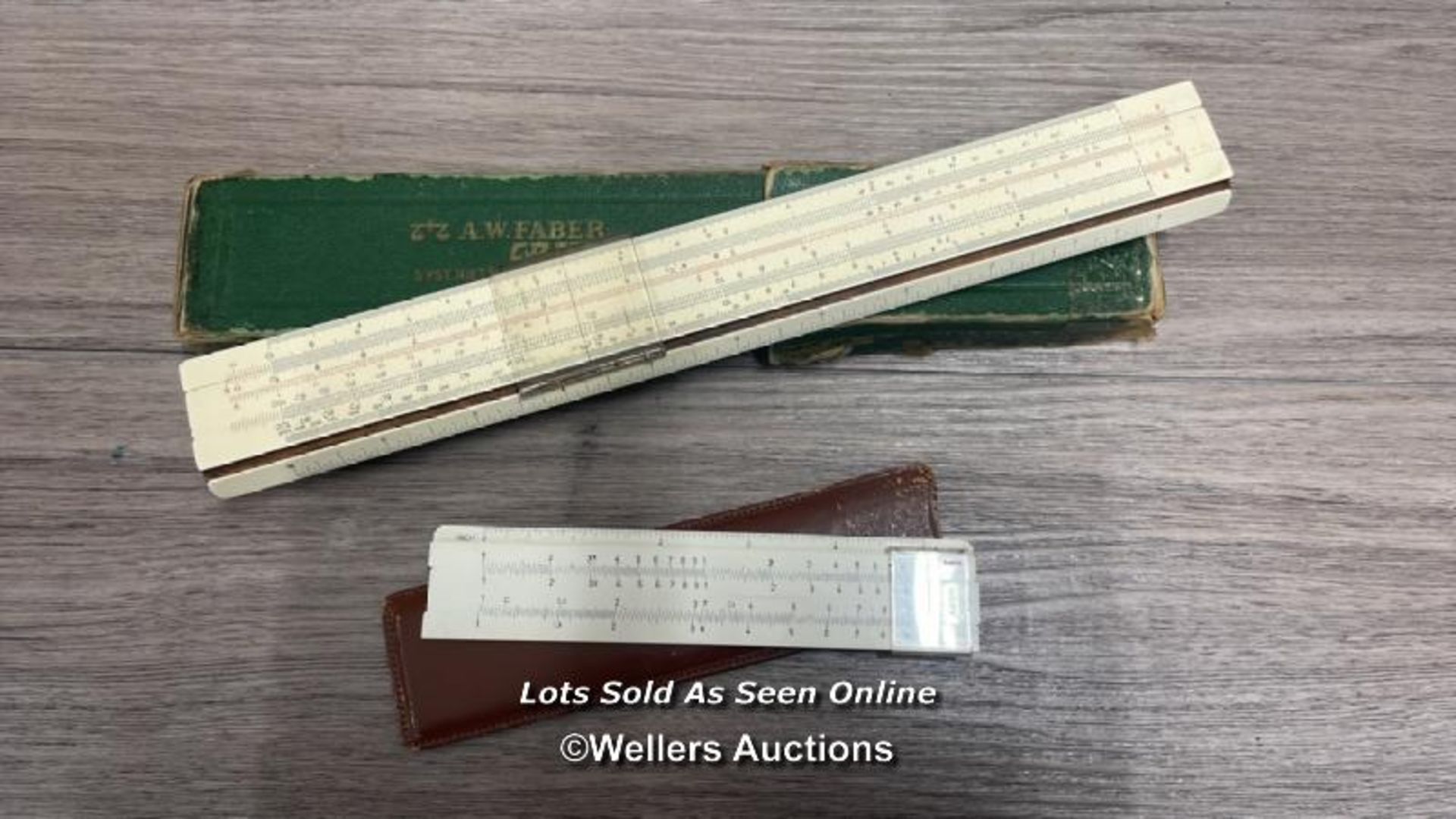 TWO VINTAGE SLIDE RULES INCLIDING A.W. FABER CASTELL V87