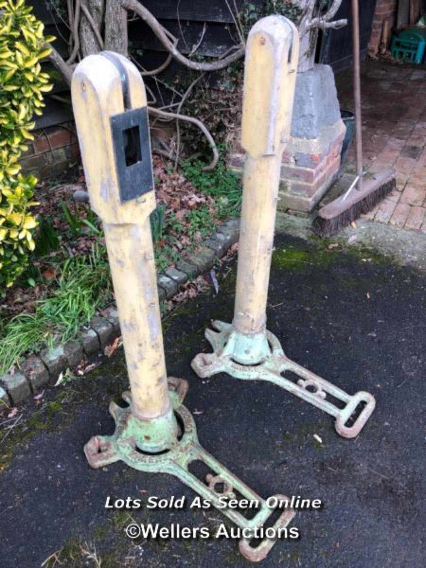 *PAIR OF EDWARDIAN SLAZENGER LAWN TENNIS NET POSTS, WOODEN POST AND CAST IRON BASE, UNRESTORED AND