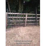PAIR OF IRON GATES, OPENING IS 3M WIDE, HEIGHT AT CENTRE IS 1.33M, HEIGHT AT SIDES IS 1.53M,