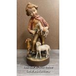 WALTER STAHLI WOOD CARVING OF A BOY WITH LAMBS, 30CM HIGH