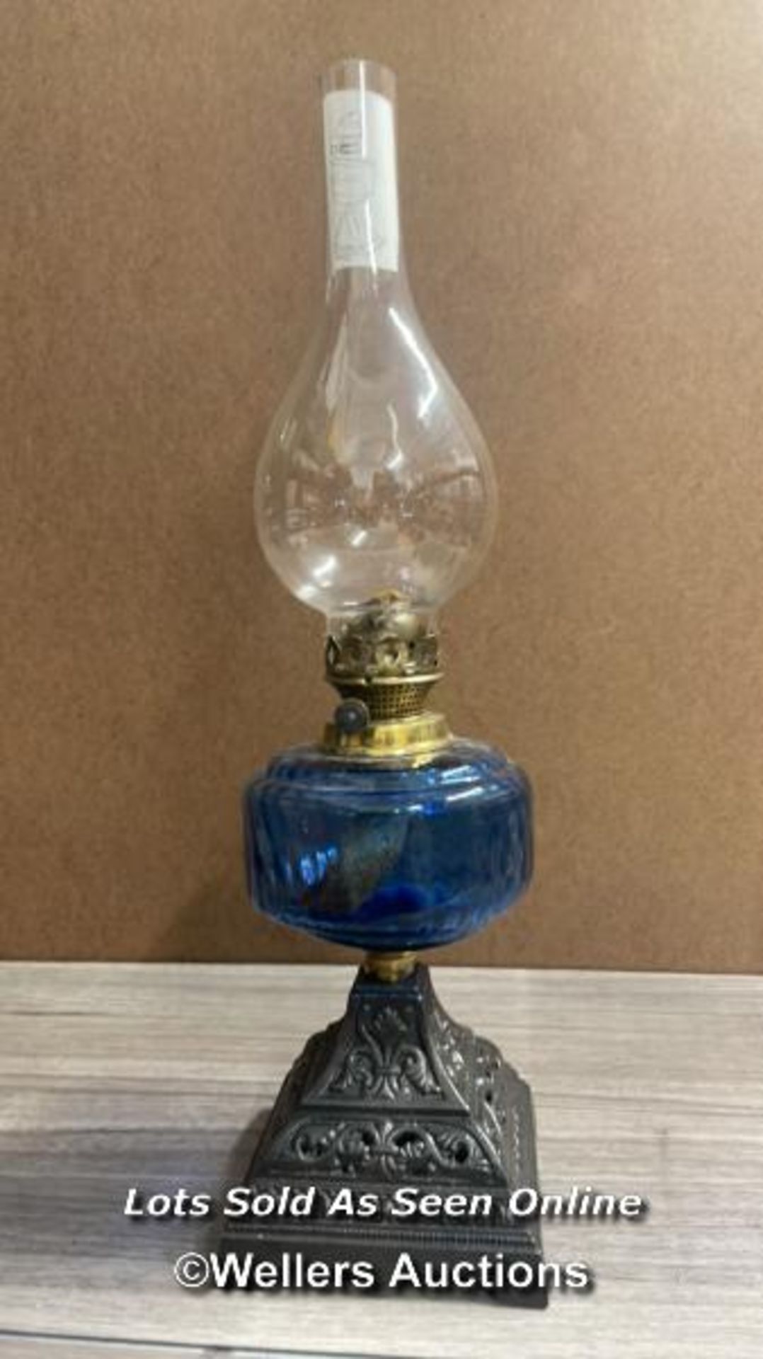 *CAST IRON OIL LAMP WITH BLUE GLASS RESERVOIR