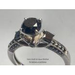 14CT WHITE GOLD RING WITH 1.20CTS ROUND CUT BLACK (ENHANCED) DIAMOND AT THE CENTRE, SIDE
