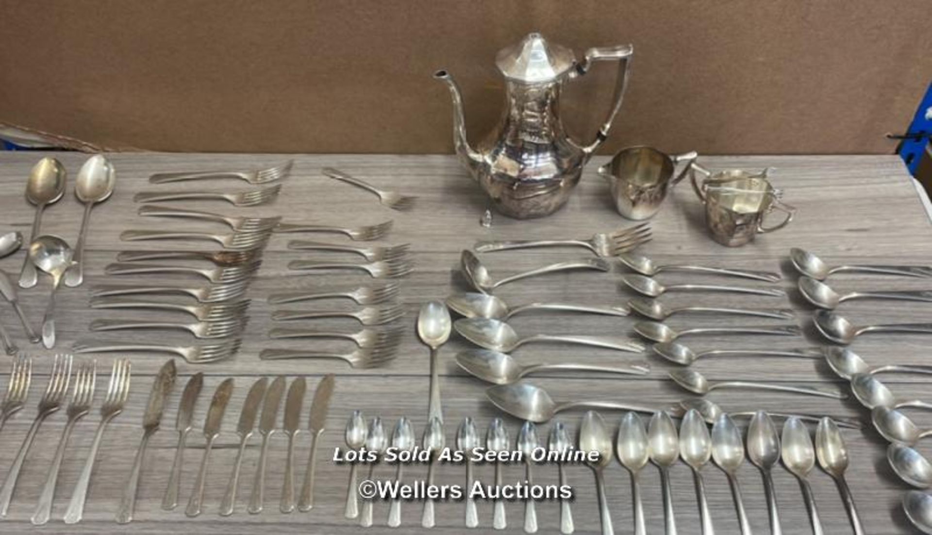 A LARGE COLLECTION OF COMMUNITY PLATE CUTLERY, COFFEE POT, MILK JUG, SUGAR BOWL AND SUGAR NIPS