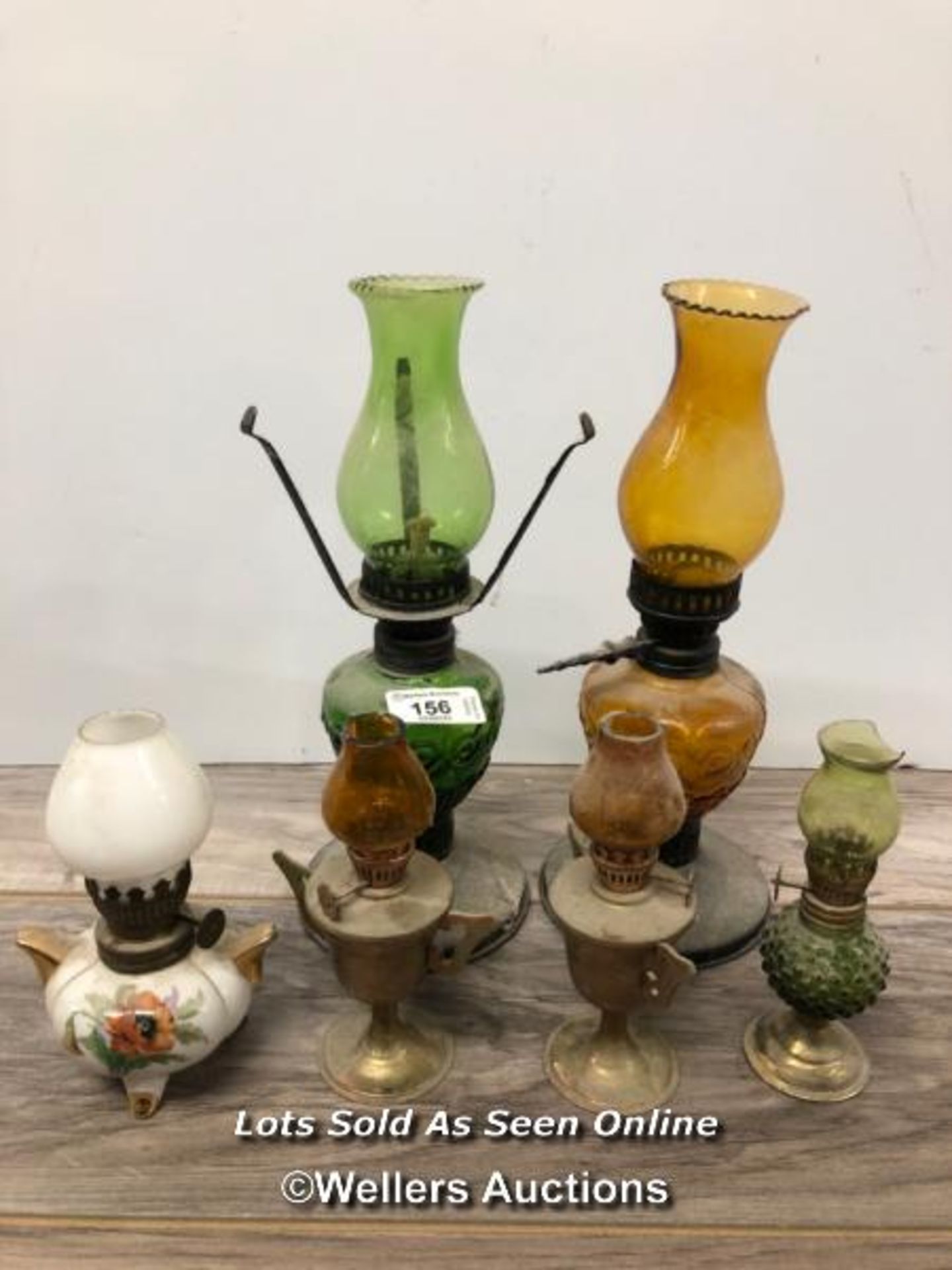 *SIX SMALL GLASS OIL LAMPS