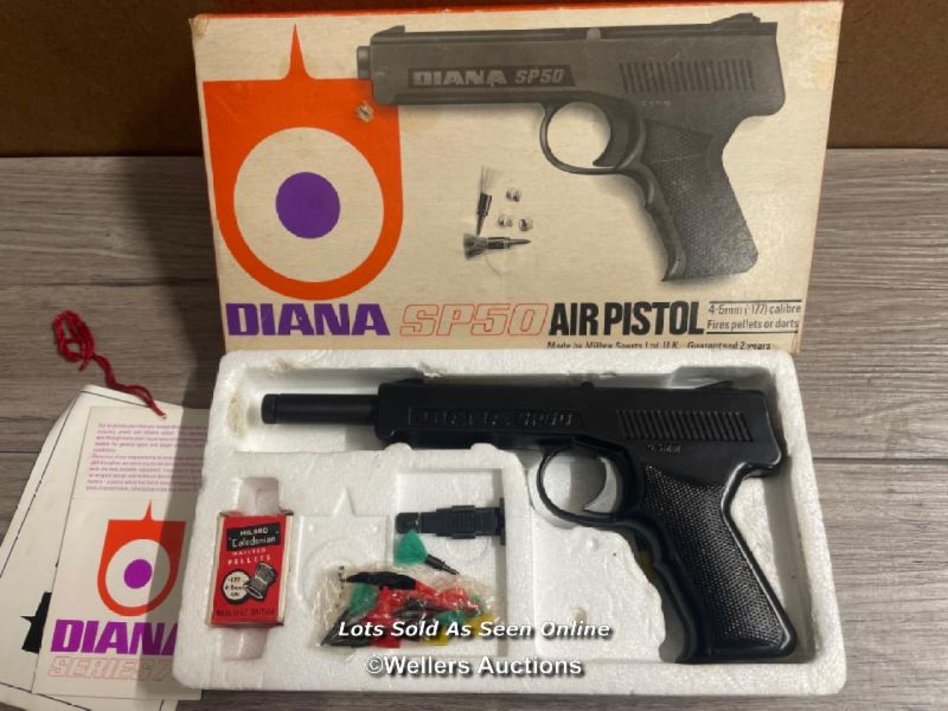 BOXED DIANA SP50 4.5MM AIR PISTOL WITH DARTS AND PELLETS.