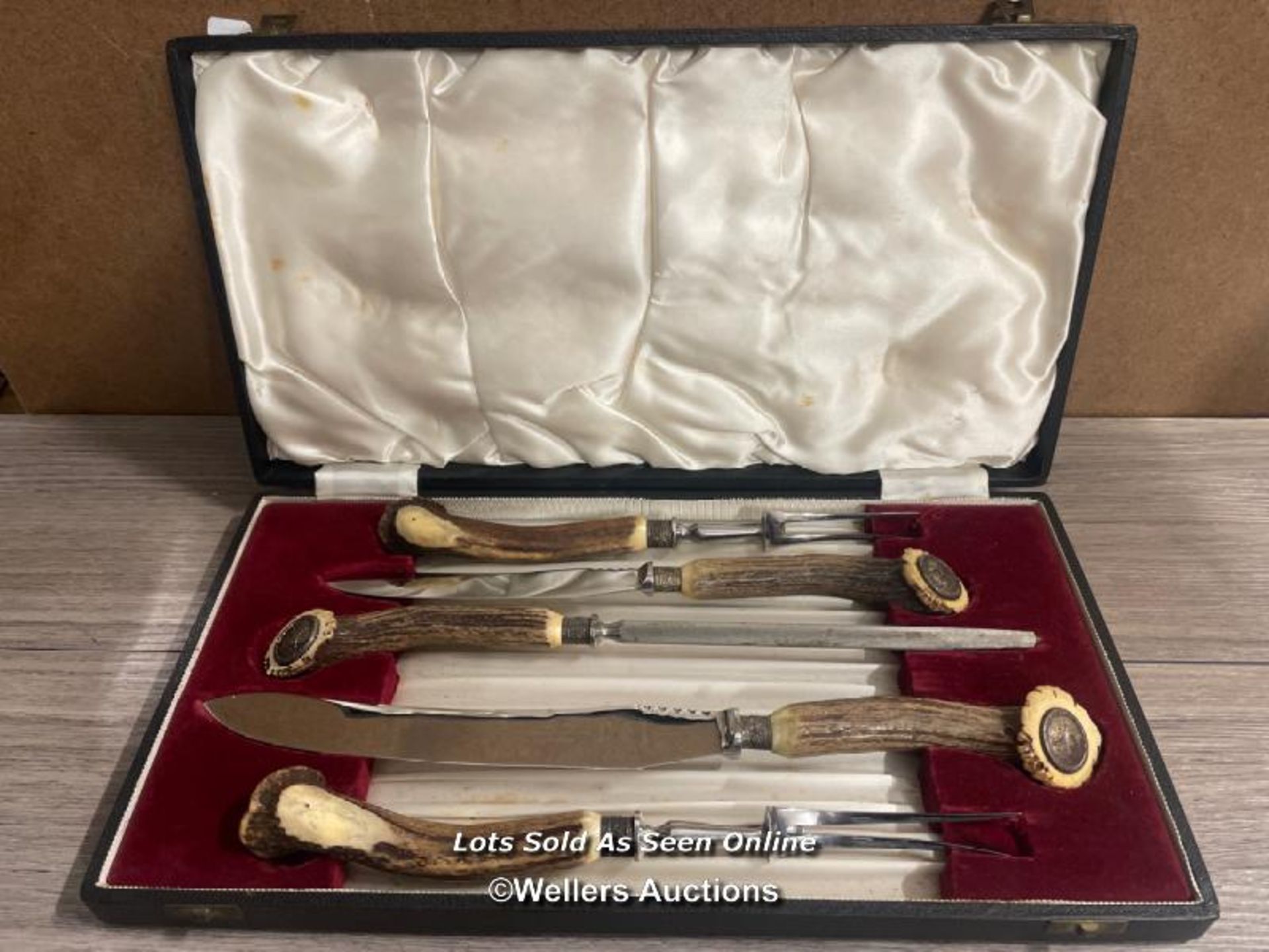 A CASED ANTLER HANDLED CARVING SET BY THOMAS WARD & SONS