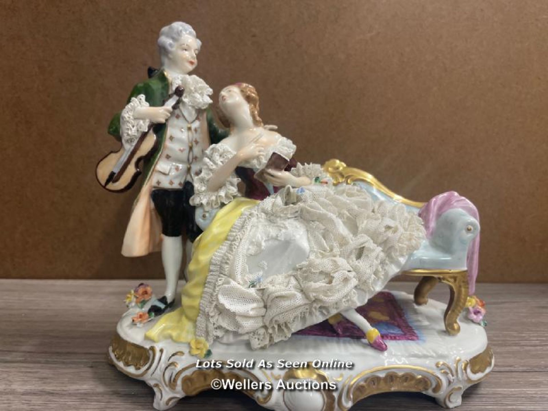 PORCELAIN FIGURINE OF A GENTLEMAN AND LADY, MARKED FOREIGN, 24CM HIGH, SOME DAMAGE TO THE LACE