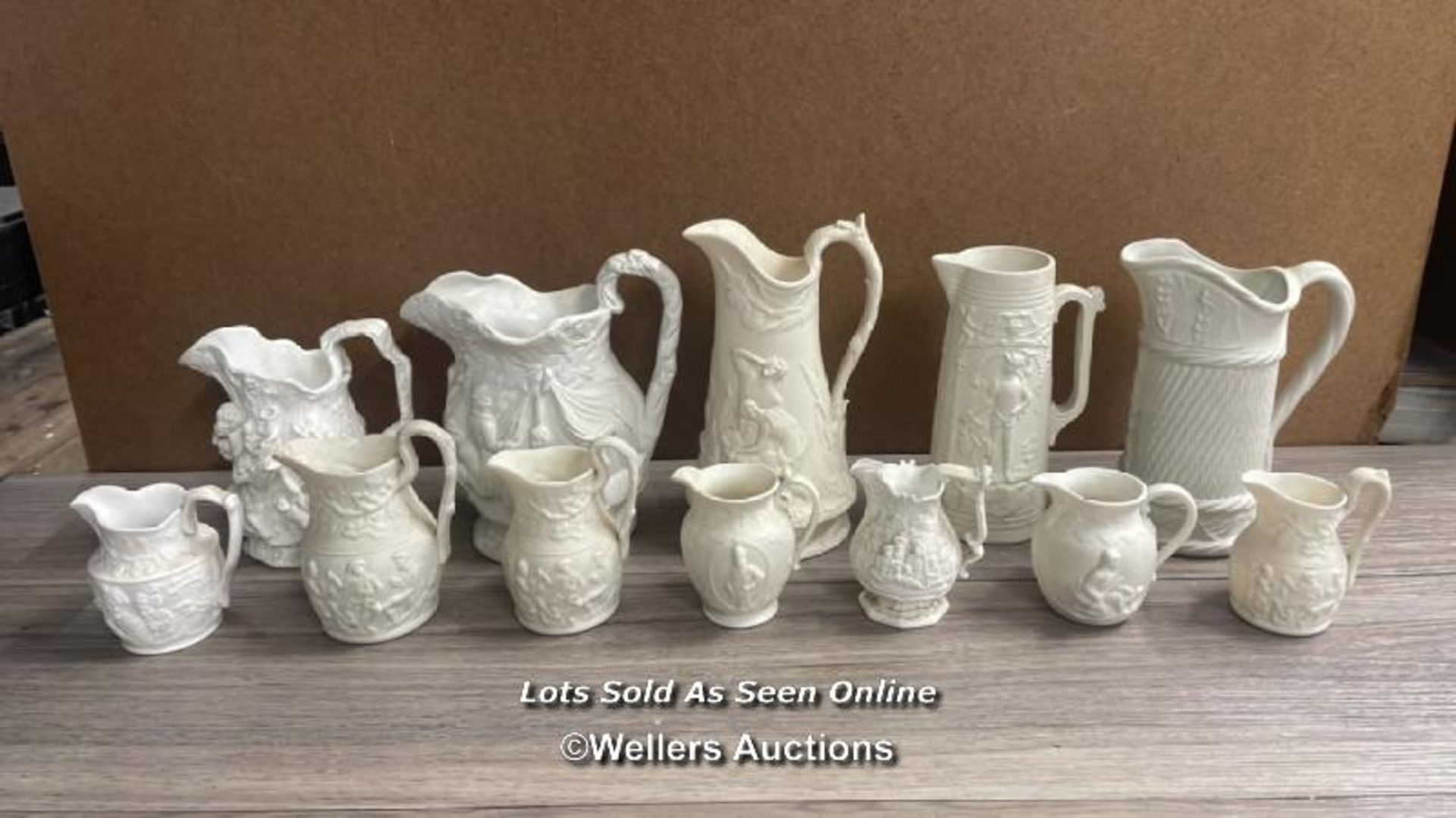 TWELVE PARIANWARE RELIEF MOULDED JUGS, COPELAND GARRET AND SAMUEL ALCOCK, OTHERS UNMARKED