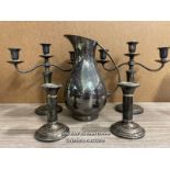 METAL WARE INCLUDING WATER JUG, TWO 3 ARMED CANDLE HOLDERS AND TWO SINGLE CANDLE HOLDERS (5)