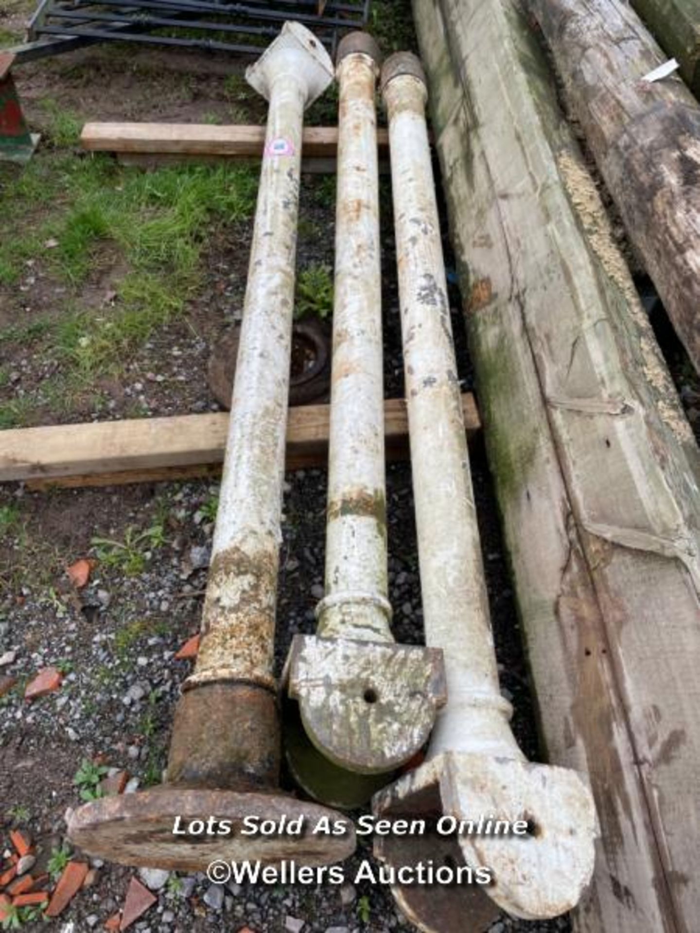 *CAST IRON POSTS, 93 INCHES LONG, TWO OUT OF THREE FOOTPLATES PRESENT / ALL LOTS ARE LOCATED AT