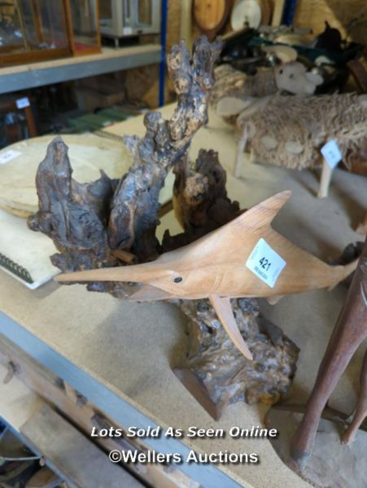 *WOODEN SWORDFISH ON DECORATIVE TREE STUMP STAND, TOGETHER WITH TWO OTHERS / ALL LOTS ARE LOCATED AT