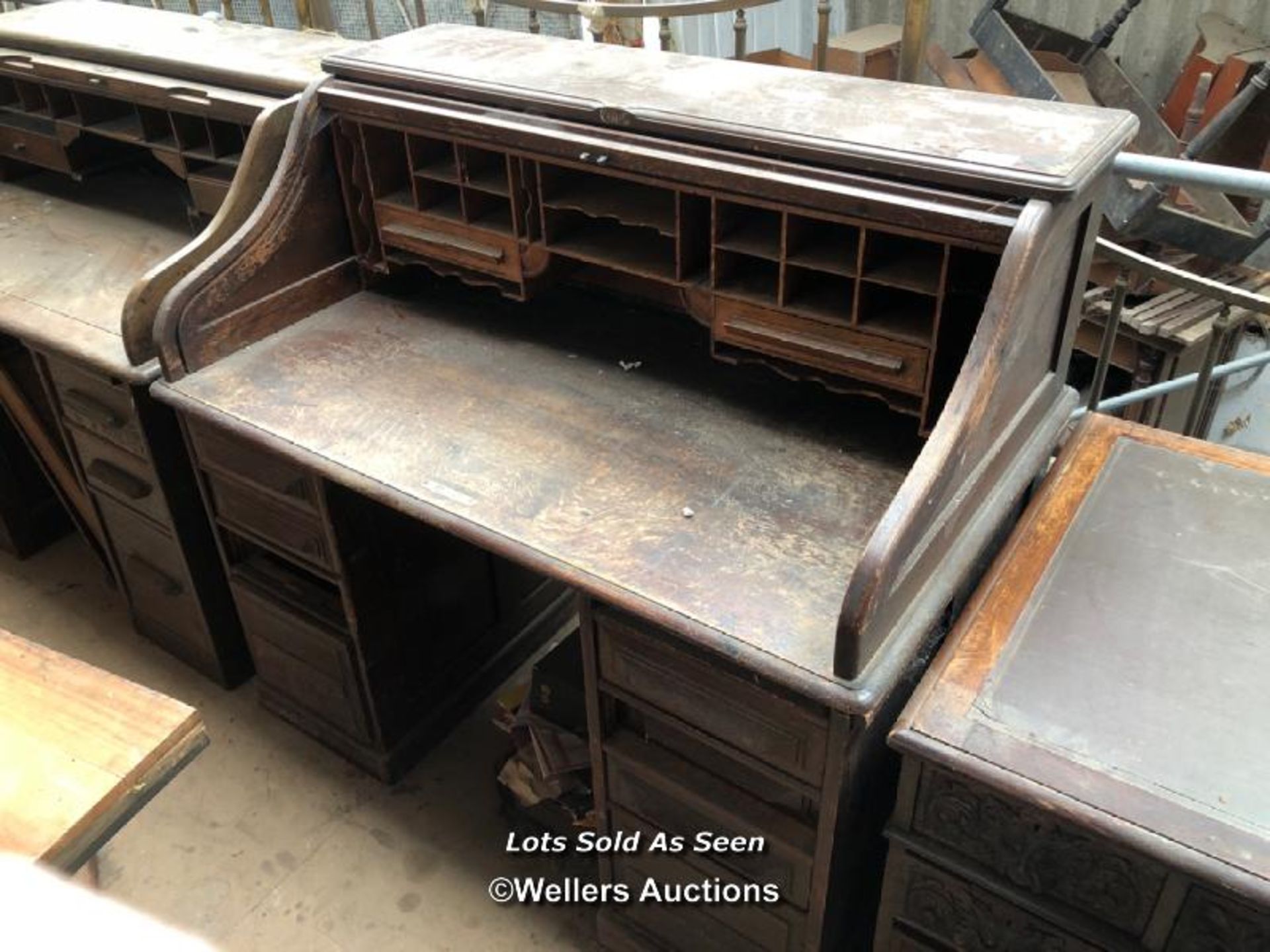 ROLL TOP DESK OVER EIGHT DRAWERS, 48.5 X 29 X 46.5 INCHES / LOCATED AT VICTORIA ANTIQUES,