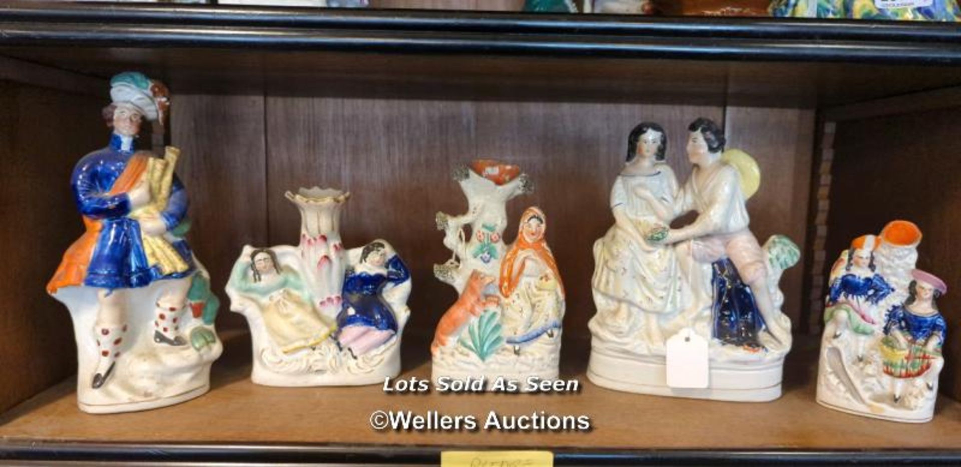 *FIVE STAFFORDSHIRE FLATBACK FIGURES OR SPILL VASES INCLUDING BAGPIPER / LOCATED AT VICTORIA