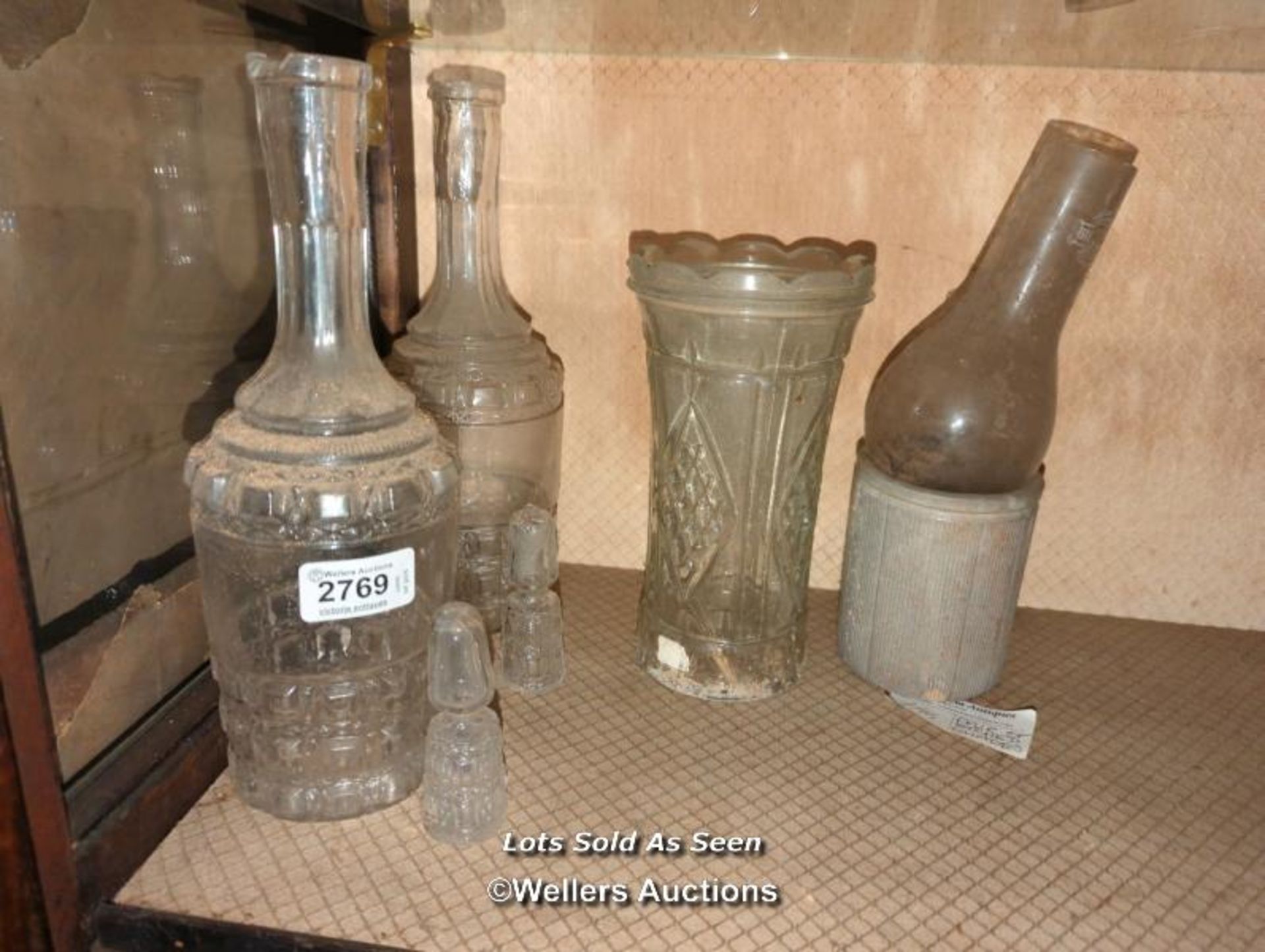 *TWO MATCHING CUT GLASS DECANTERS WITH TOPS, CUT GLASS VASE AND BOTTLE / LOCATED AT VICTORIA