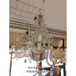 *GLASS HANGING CHANDELIER WITH SEVEN SCROLLING ARMS HUNG WITH PRISM DROPS / LOCATED AT VICTORIA