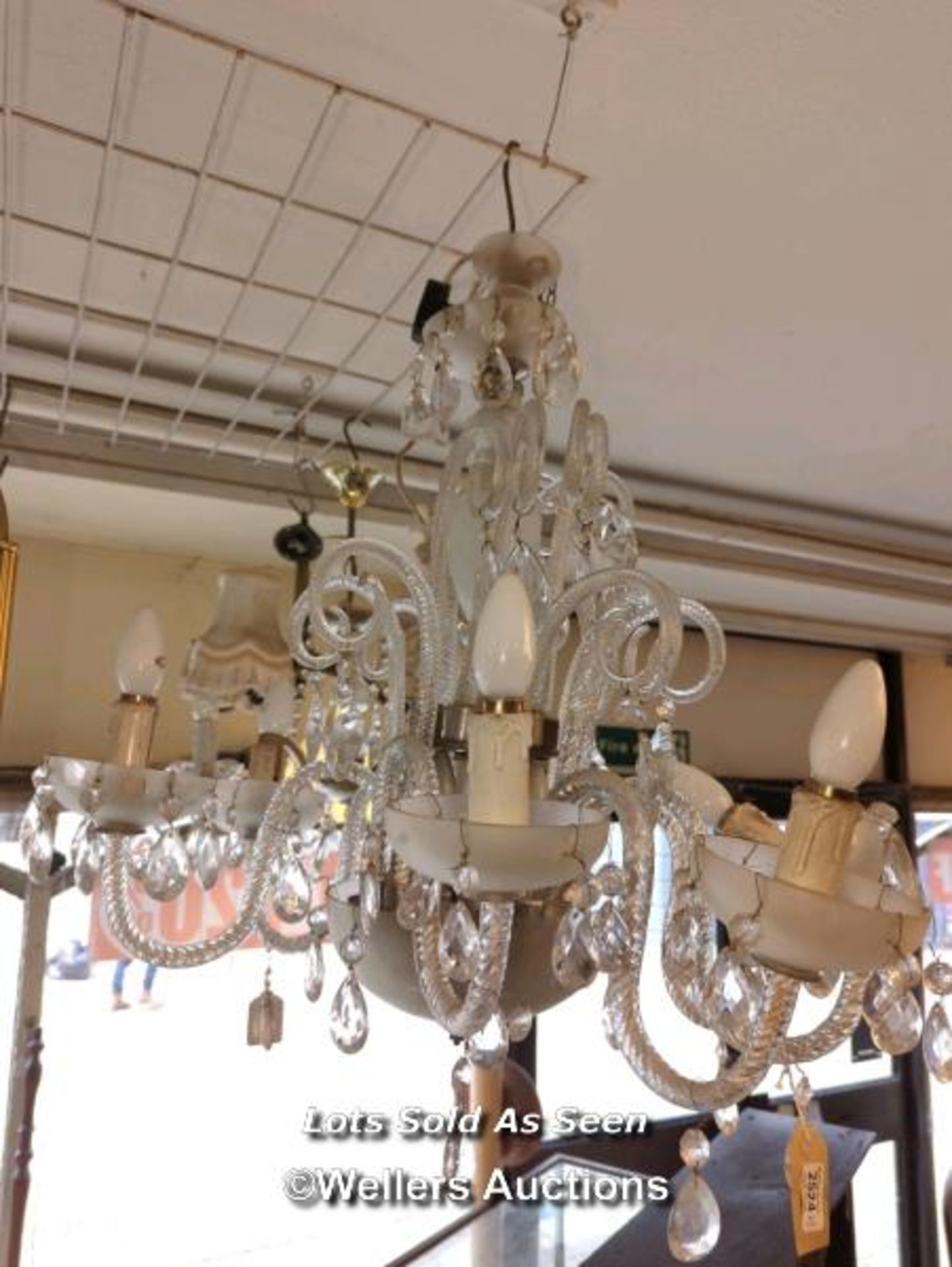 *GLASS HANGING CHANDELIER WITH SEVEN SCROLLING ARMS HUNG WITH PRISM DROPS / LOCATED AT VICTORIA