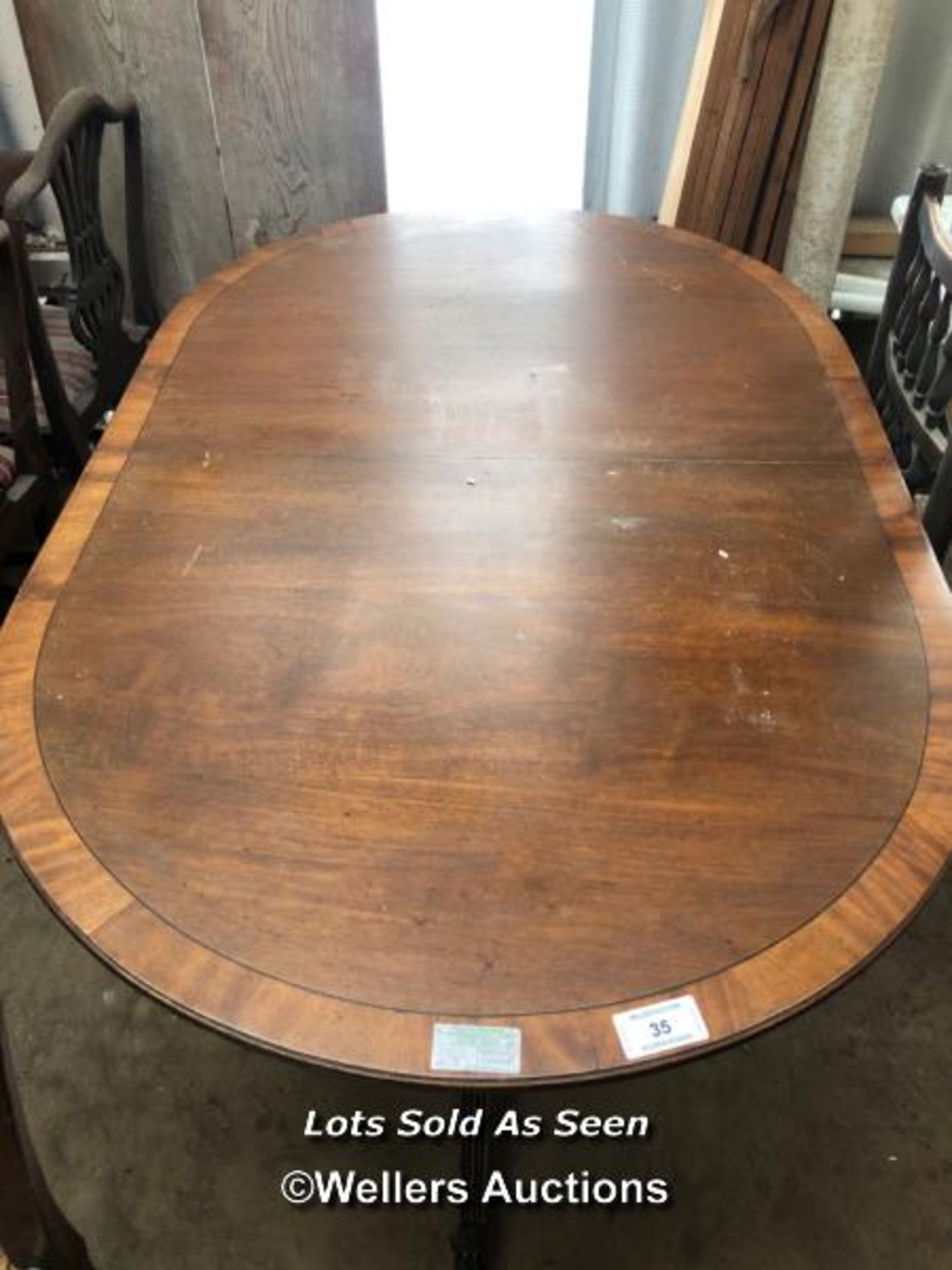 OAK OVAL EXTENDING DINING TABLE ON TWO TRIPOD BASES WITH CLAW FEET, 59.5 X 38.5 X 29.5 INCHES / - Image 2 of 6