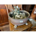 *APPROX 25 OLD GLASS BOTTLES IN A COPPER JARDINIERE / LOCATED AT VICTORIA ANTIQUES, WADEBRIDGE, PL27