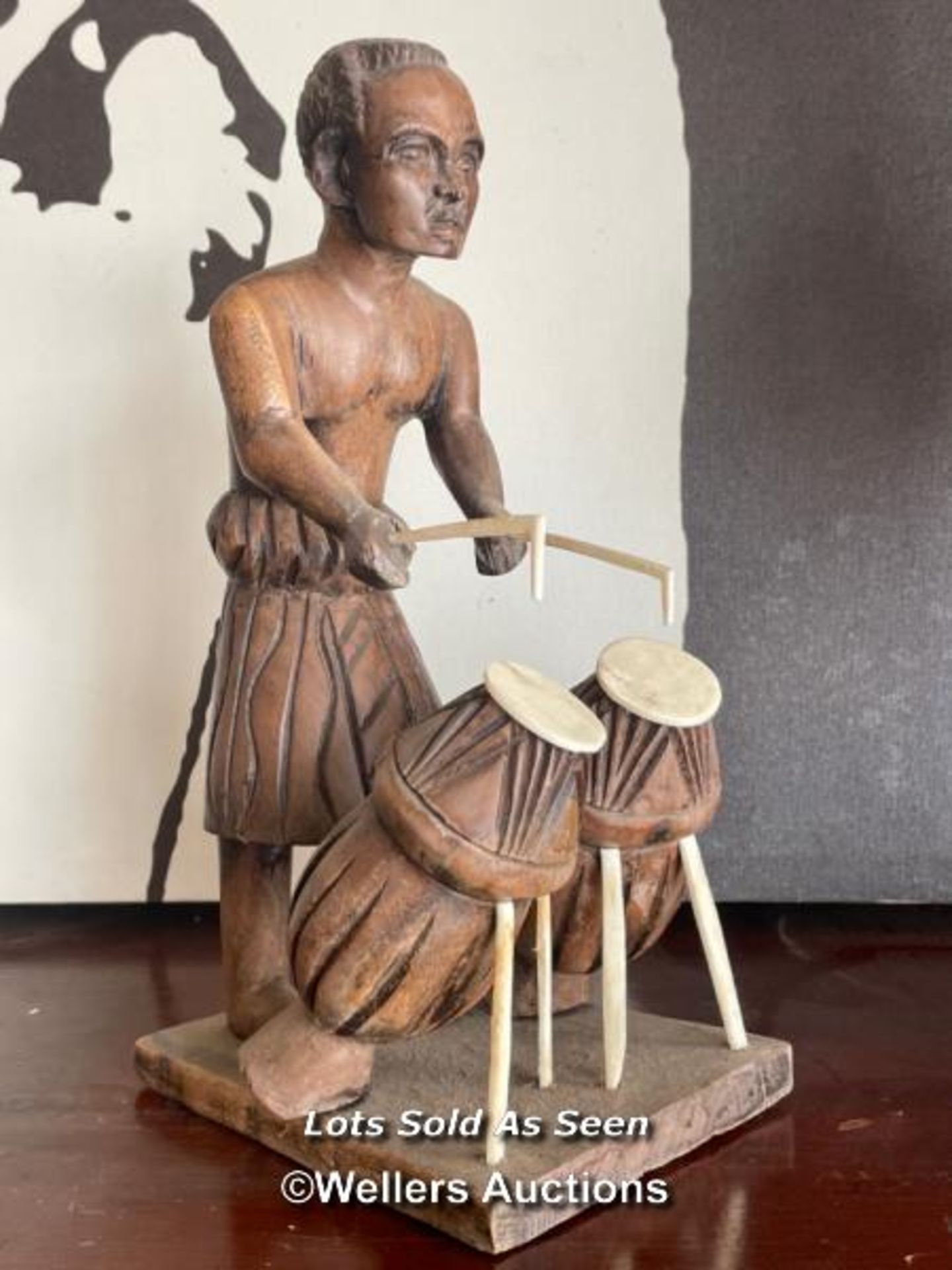 *SMALL CARVED AFRICAN FIGURE PLAYING DRUMS, 26CM / LOCATED AT VICTORIA ANTIQUES, WADEBRIDGE, PL27