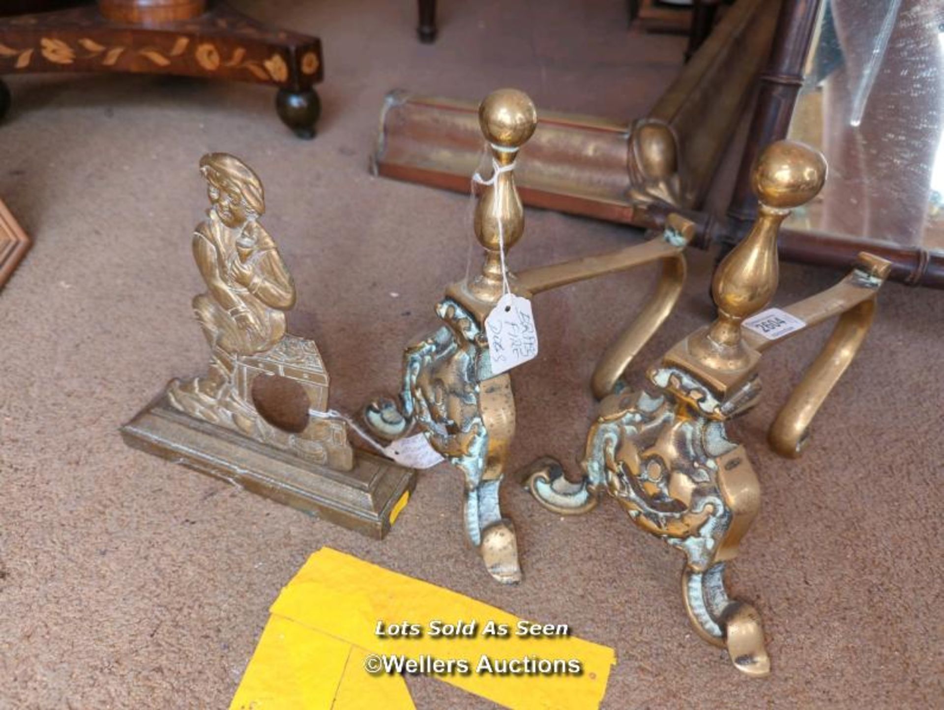 *PAIR OF SMALL BRASS FIREDOGS AND A SMALL BRASS FIGURAL DOORSTOP / LOCATED AT VICTORIA ANTIQUES,