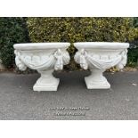 *PAIR OF LARGE WHITE STONE AND CRUSHED MARBLE URNS, LOOP AND SWAG DESIGN AROUND SIDES WITH ANTIQUE