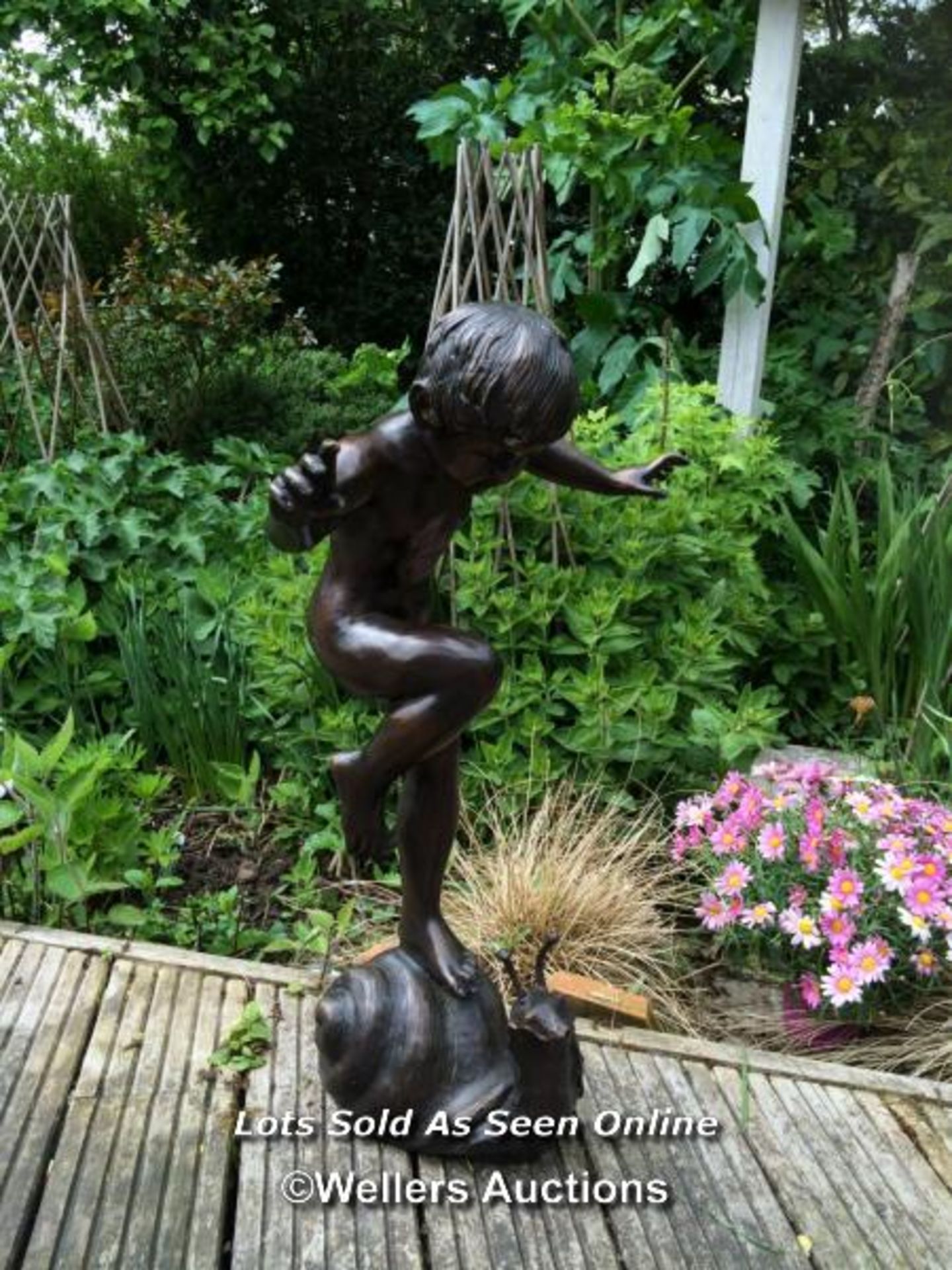 *GARDEN WATER FEATURE OF A BRONZE BOY ON SNAIL, SNAIL IS PIPED FOR WATER SO CAN BE USED AS A WATER - Image 2 of 5