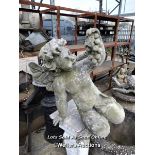*RECONSTITUTED STONE AND FIBREGLASS CHERUB STATUE, 52CM (H) X 60CM (L), SOME CRACKS AND CHIPS