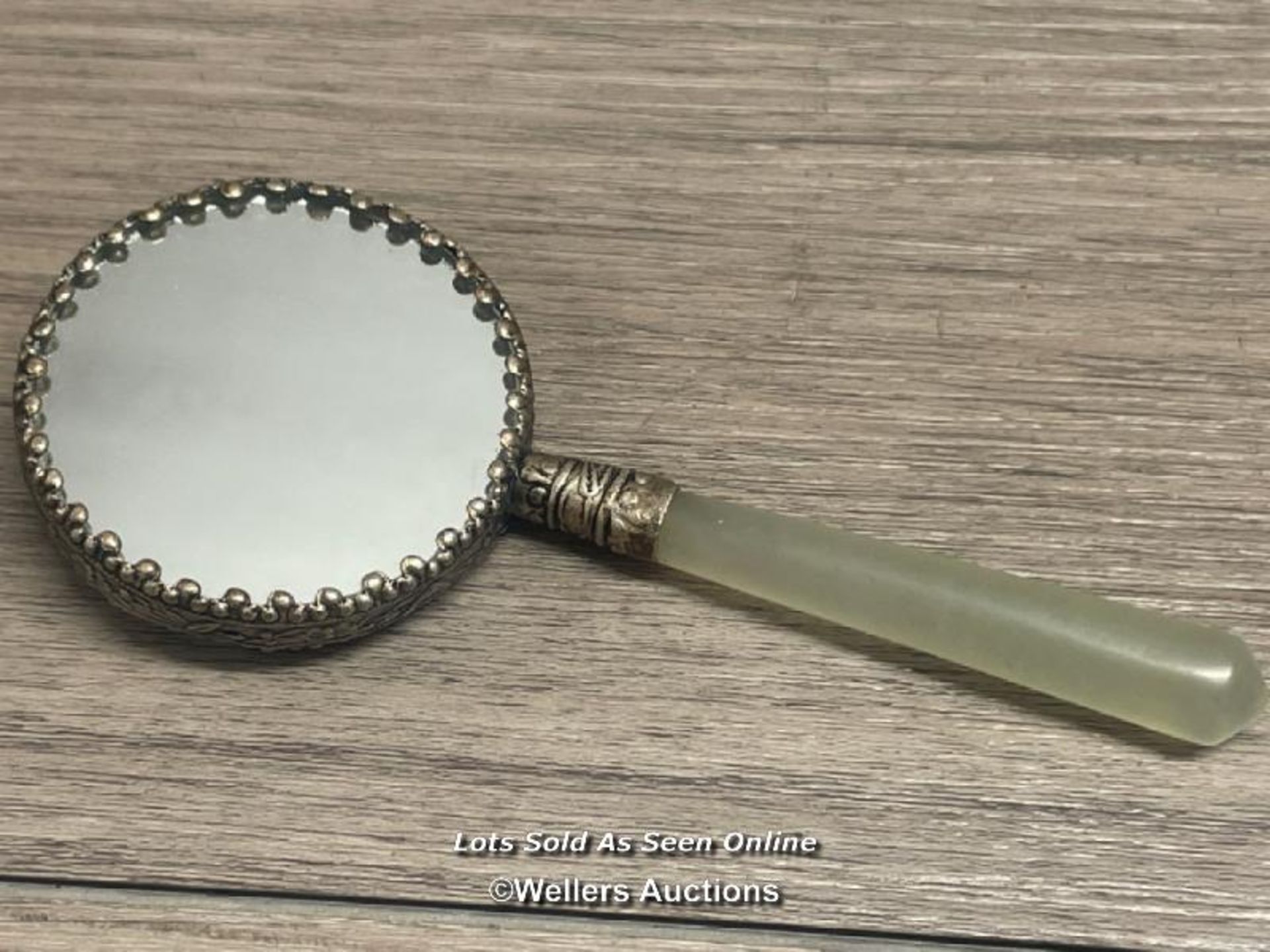 SMALL CHINESE SILVERED HAND MIRROR DECORATED WITH FLAMING DRAGON WITH ONYX HANDLE, 5CM DIAMETER