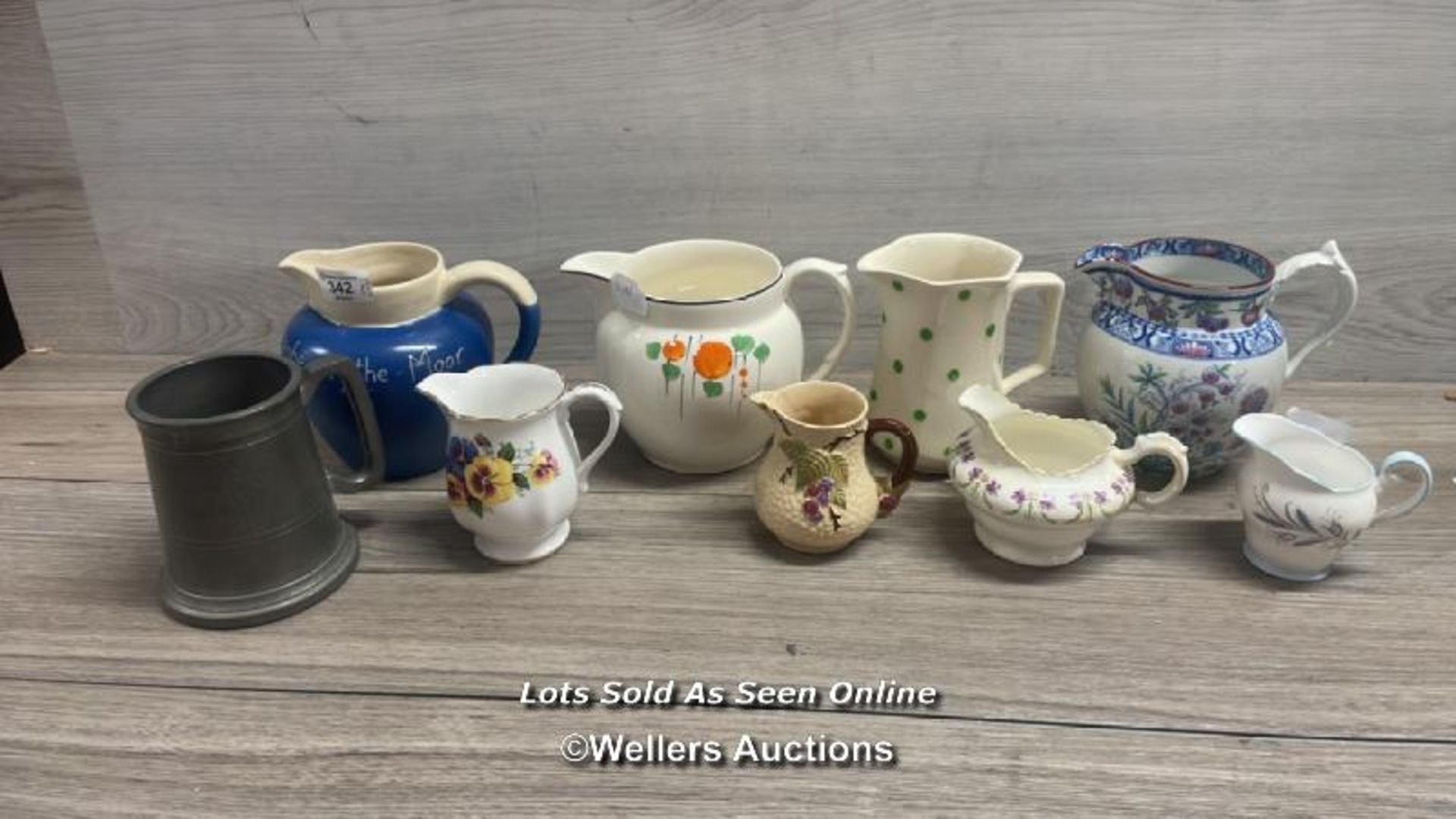 EIGHT ASSORTED JUGS INCLUDING WADE AND A PEWTER TANKARD