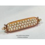 STOCK PIN / BROOCH IN YELLOW METAL WITH THREE ROWS OF SPLIT PEARLS AND ROSE CUT DIAMOND