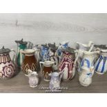 *A COLLECTION OF VICTORIAN JUGS, SOME RELIEF MOULDED, SOME WITH LIDS, SOME GRADUATED PAIRS