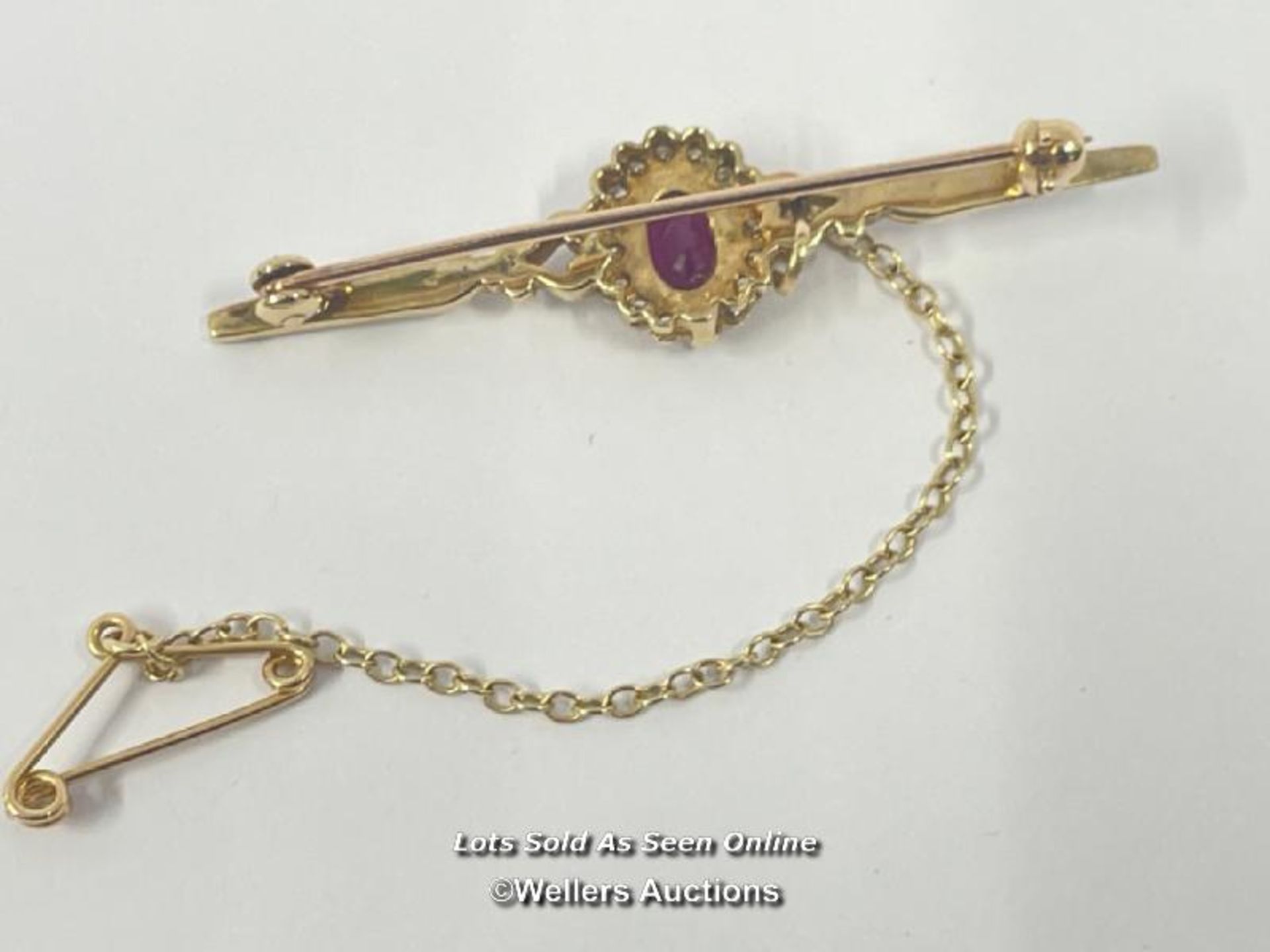 RUBY AND DIAMOND BAR BROOCH WITH SAFETY CHAIN, RUBY ESTIMATED WEIGHT 0.54CT, DIAMONDS ESTIMATED - Image 3 of 5
