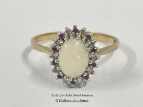 OPAL, DIAMOND AND RUBY CLUSTER RING IN HALLMARKED 9CT, GOLD. OPAL MEASURES 8.80MM X 6.70MM. DIAMONDS