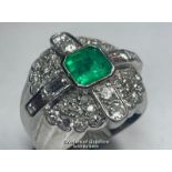 EMERALD AND DIAMOND RING STAMPED PT950, SET WITH ROUND BRILLIANT CUT, SINGLE CUT AND BAQUETTE CUT