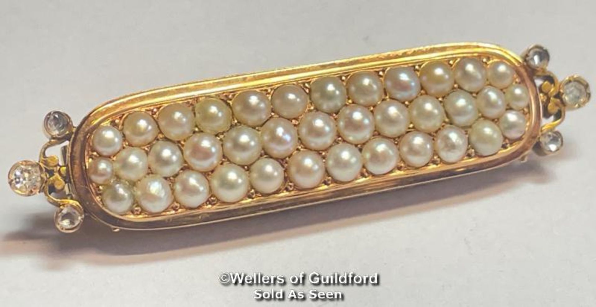 STOCK PIN IN YELLOW METAL WITH THREE ROWS OF SPLIT PEARLS AND ROSE CUT DIAMOND TERMINATIONS, NOT
