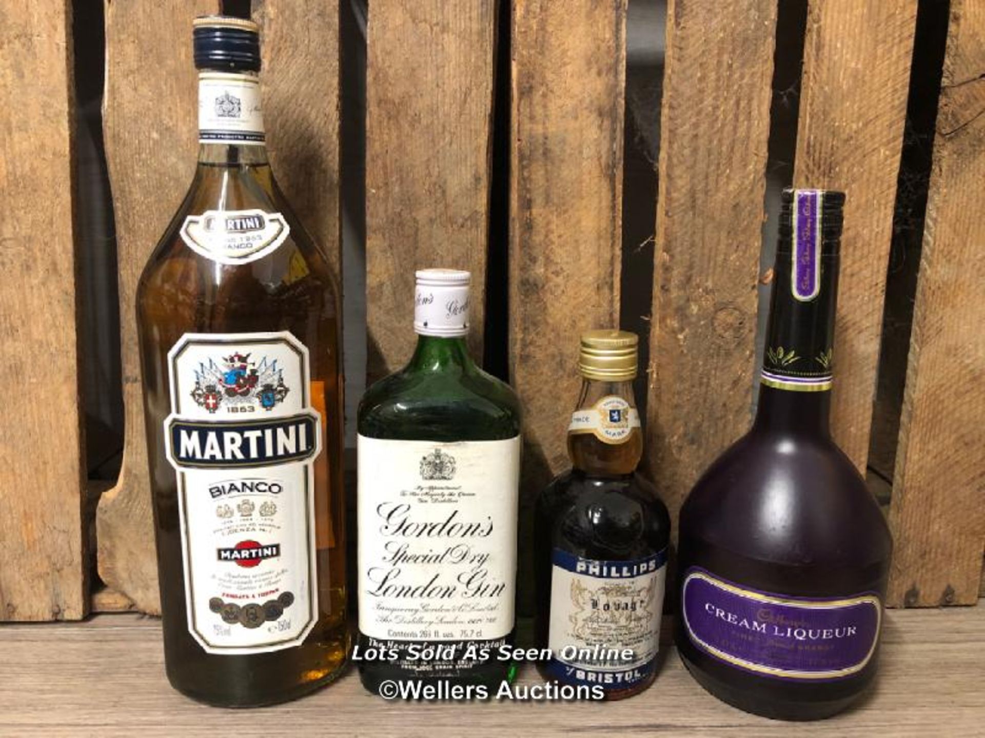 FOUR BOTTLES OF ASSORTED ALCOHOL INCL. MARTINI BIANCO, GORDON'S GIN, PHILLIPS OF BRISTOL LOVAGE &
