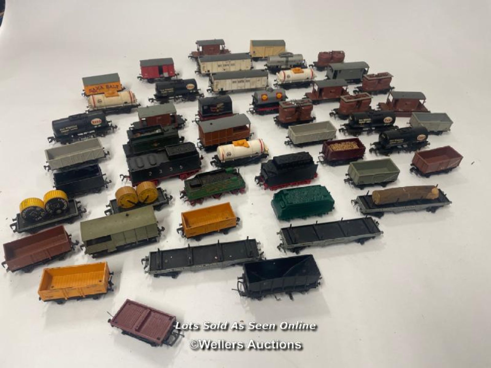 Large collection of unboxed railway cars and parts