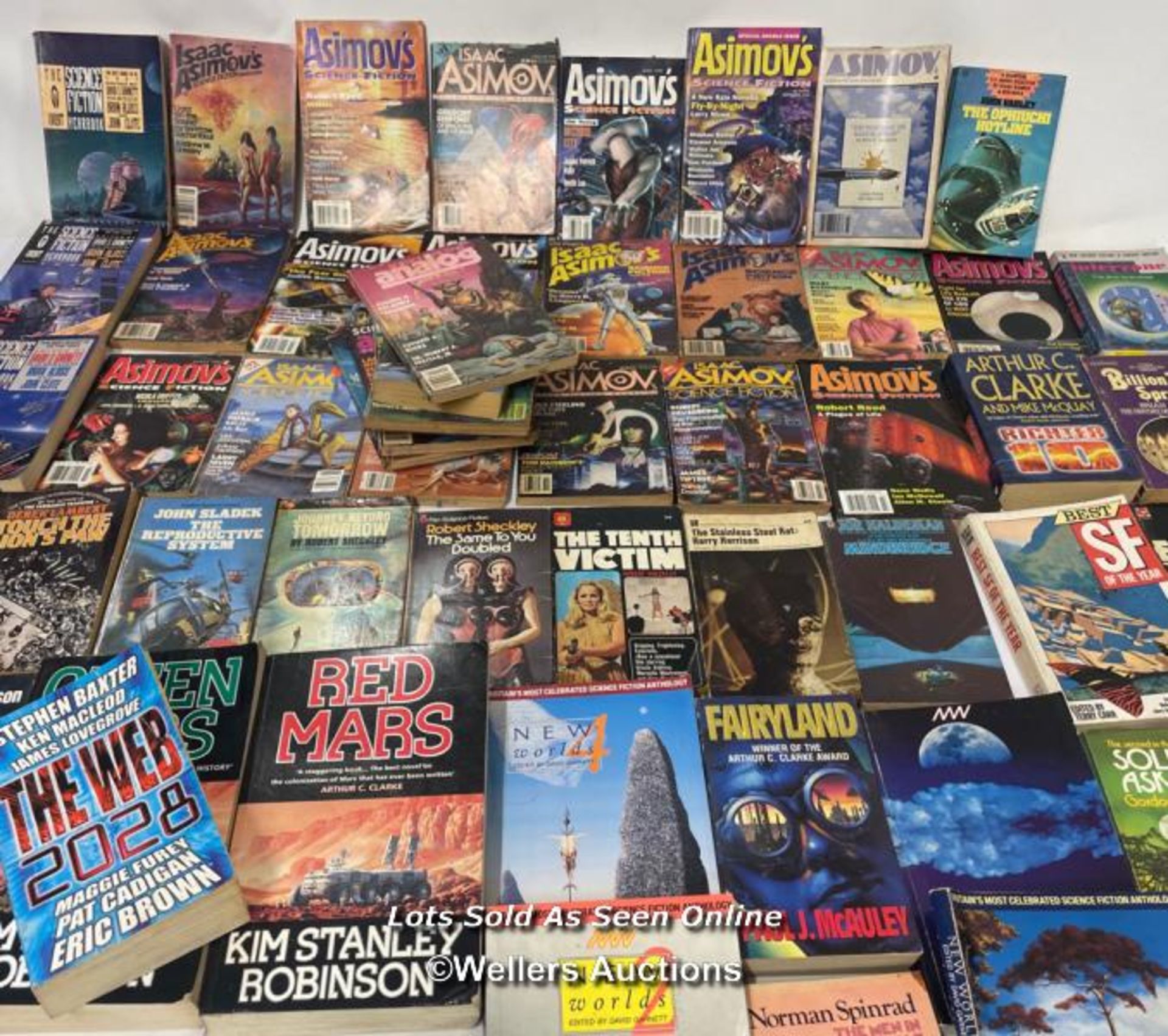 A large collection of Sci-Fi paperback books mainly Isaac Asimov with Science Fiction Analog and